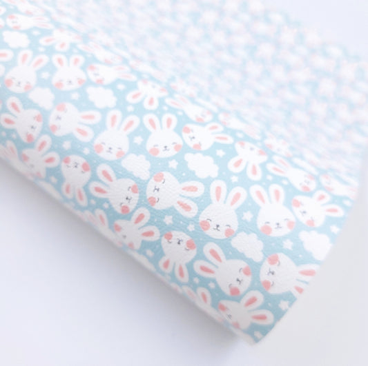 Bunny Faces on Soft Blue Artisan Leatherette
